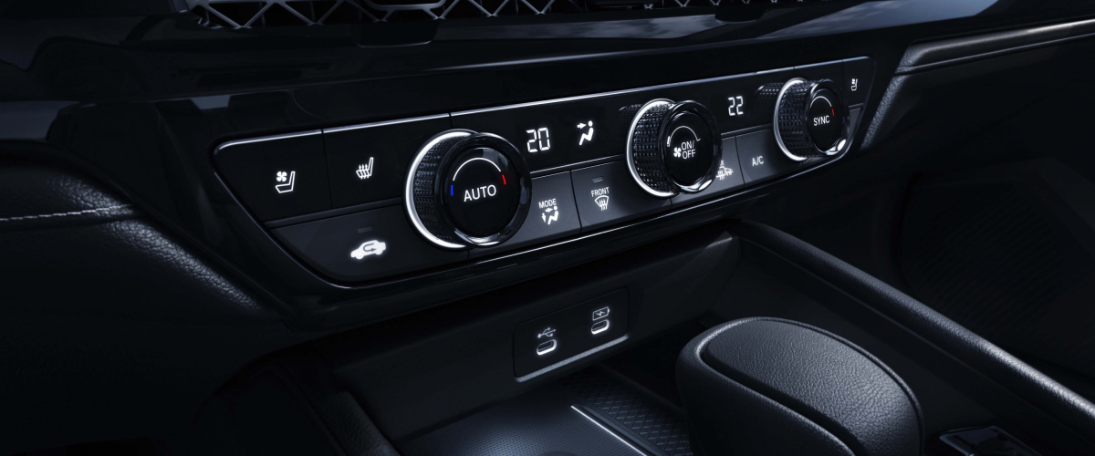 3/4 closeup view of the climate controls in the centre console.
